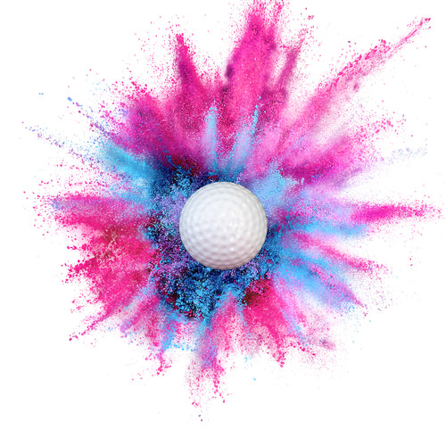 pink or blue golf ball filled with color powder for gender reveal party