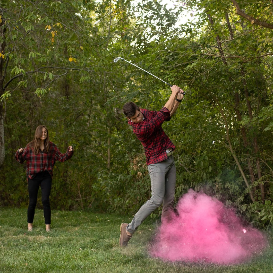 pink gender reveal sports golf ball with colored powder 